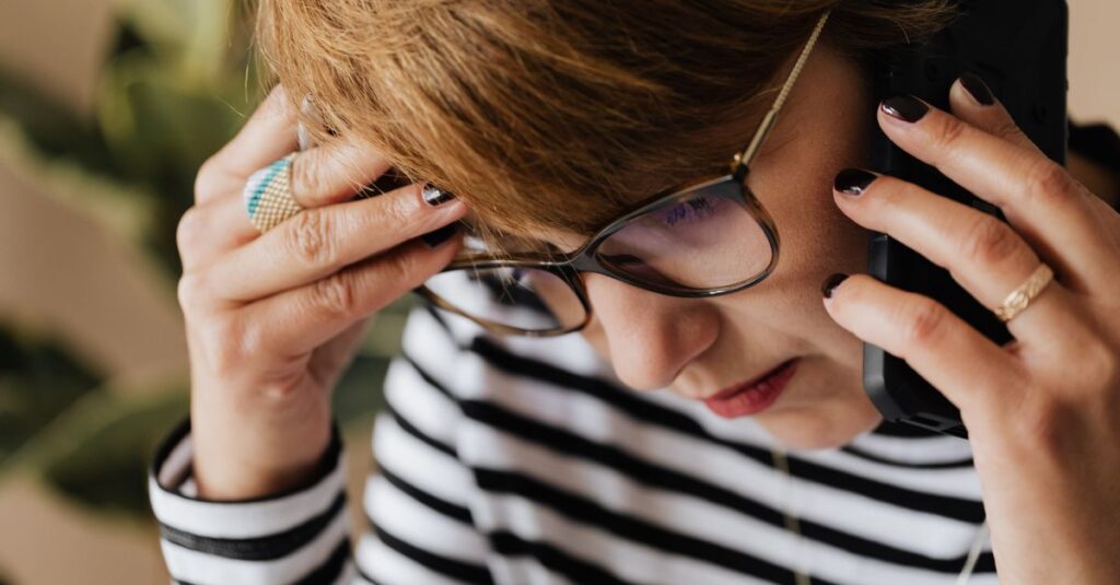 worried elderly woman phone call